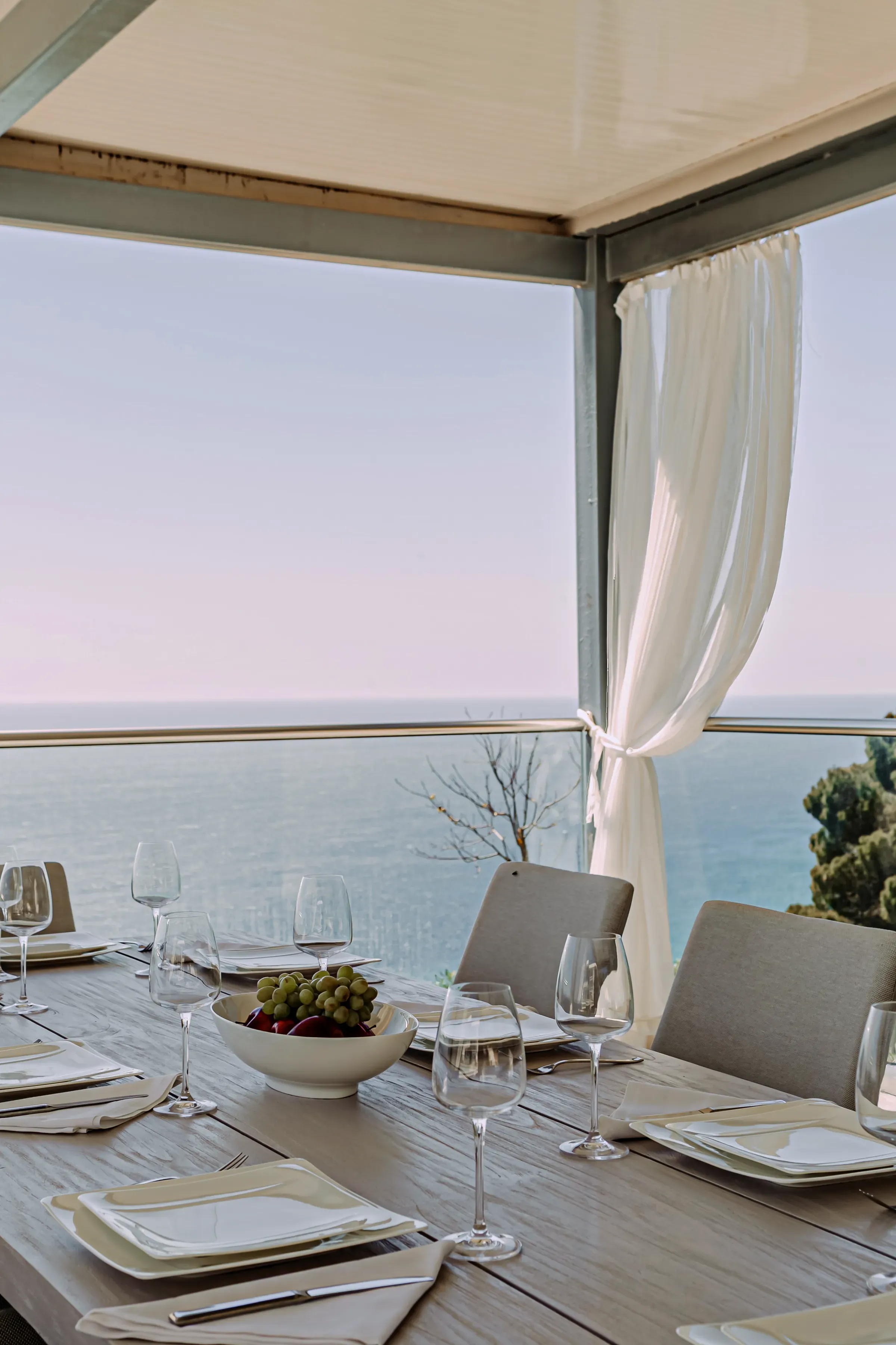 Flowing curtains framing the sea view
