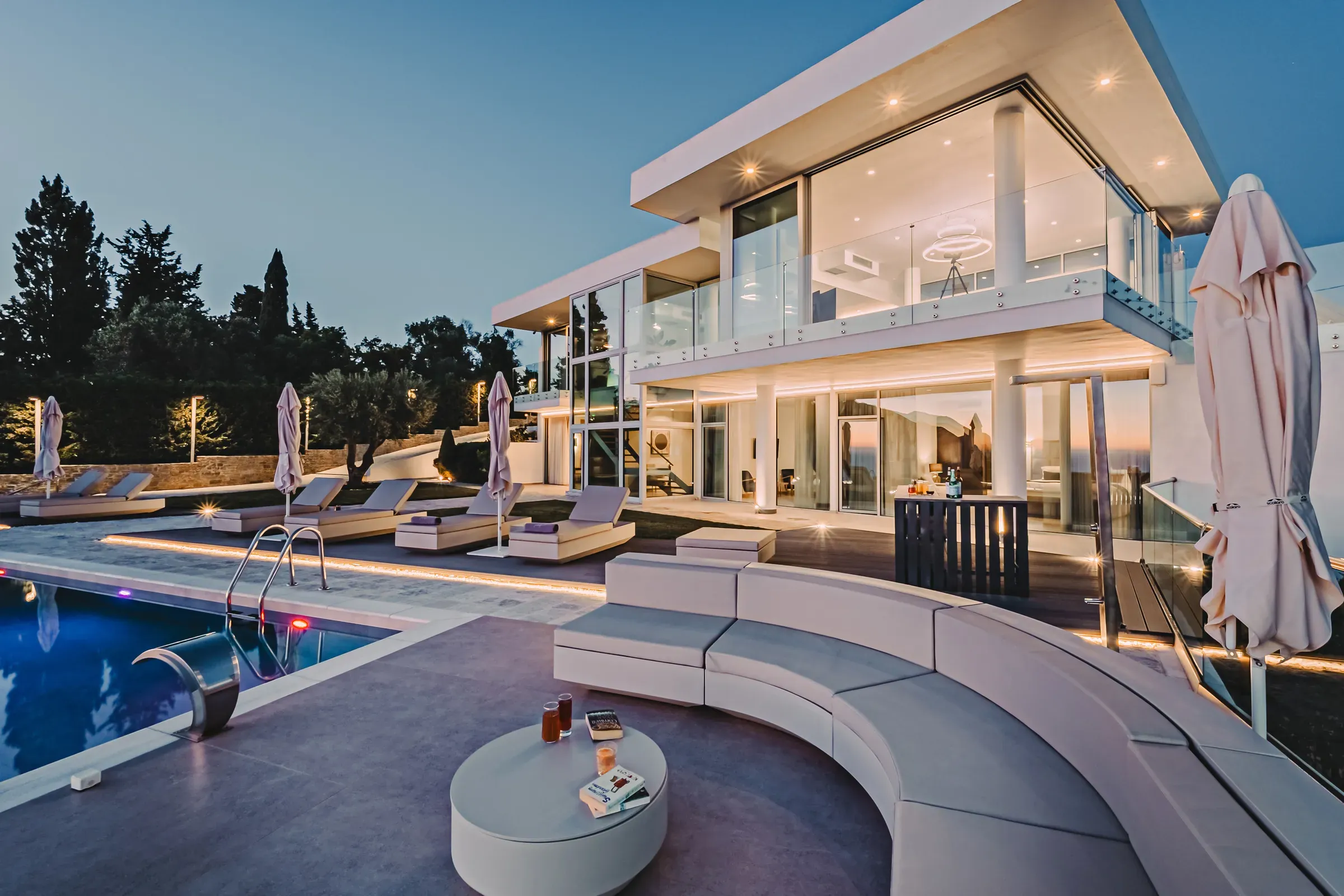 The villa and pool during blue hour
