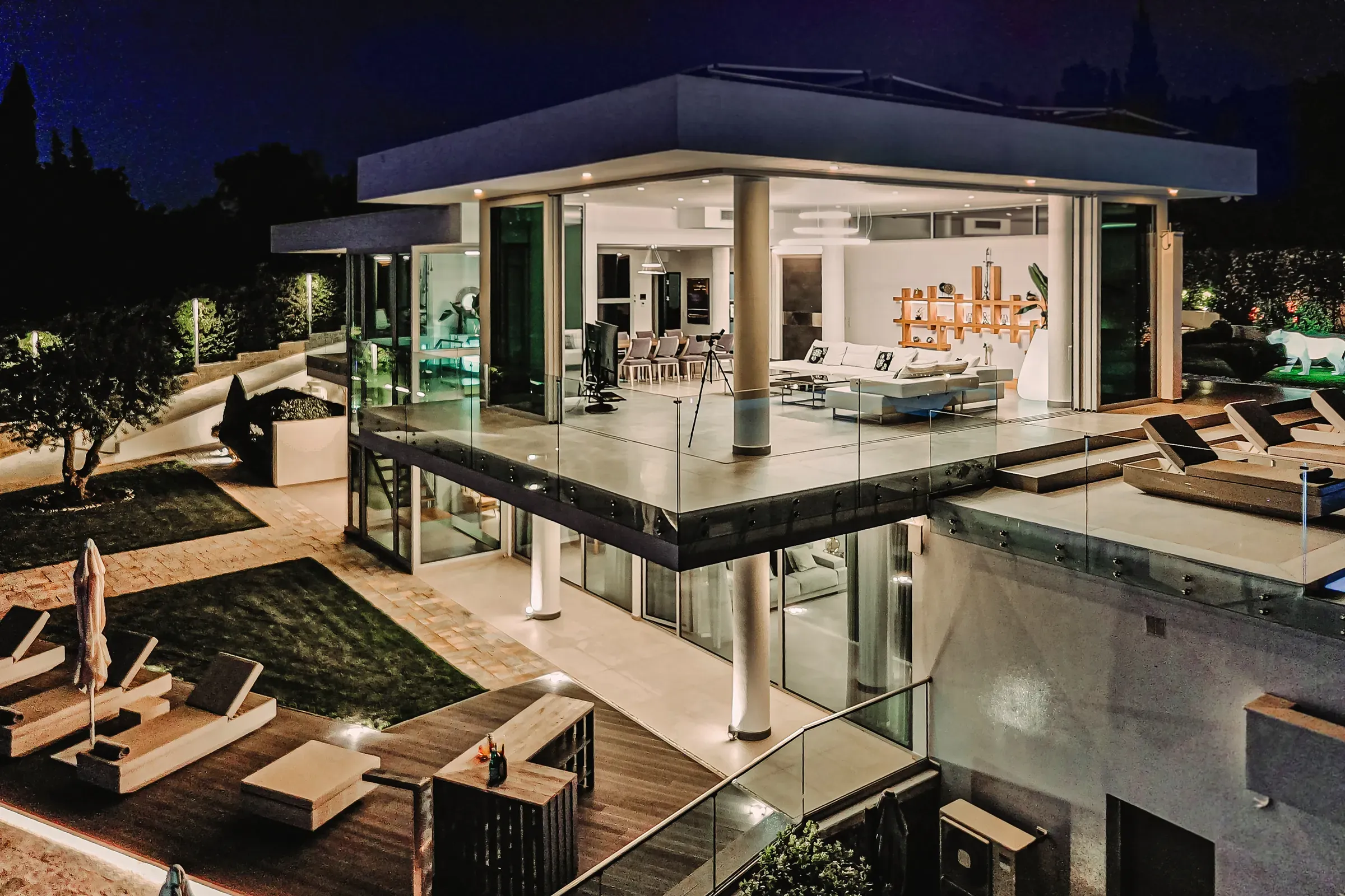 Illuminated villa facade at dusk