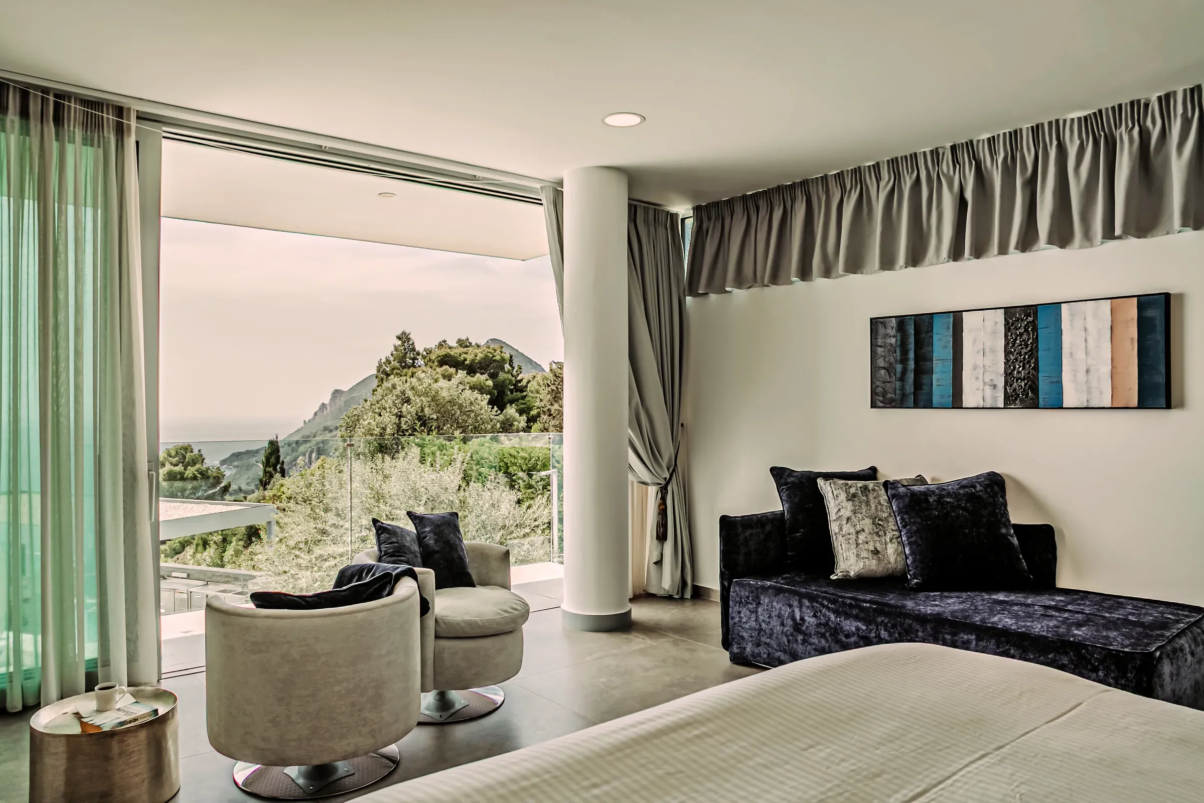 Bedroom opening to a sea-view balcony