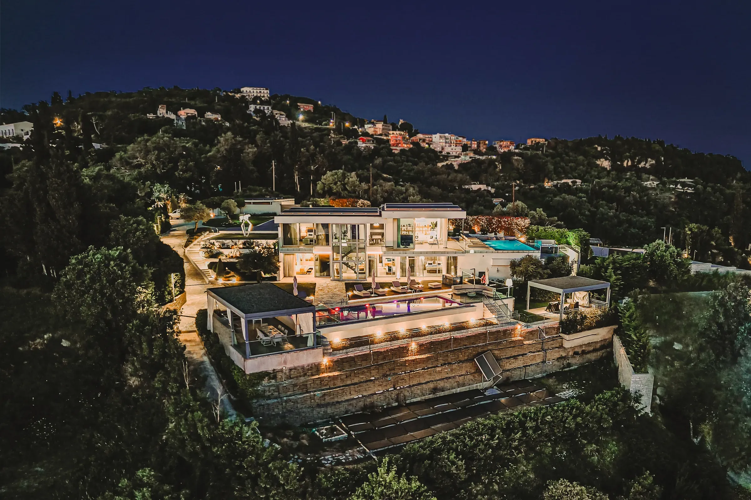Aerial view of the villa at dusk